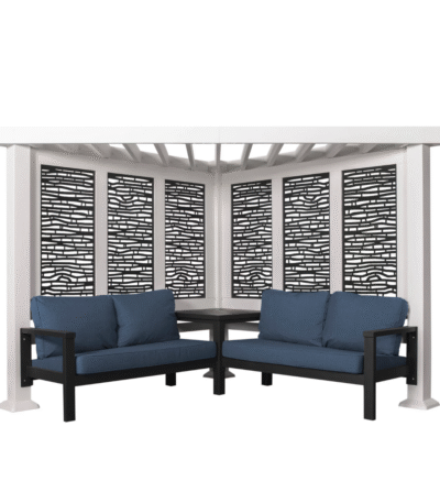 The Backyard Discovery Ridgedale Traditional Pergola features built-in conversation seating with two black-framed corner sofas, blue cushions, a small matching table, and decorative black privacy screens.